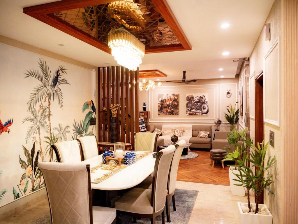 a dining room with a table and chairs at MG Luxury Stays - Entire 4 BHK in Panchkula