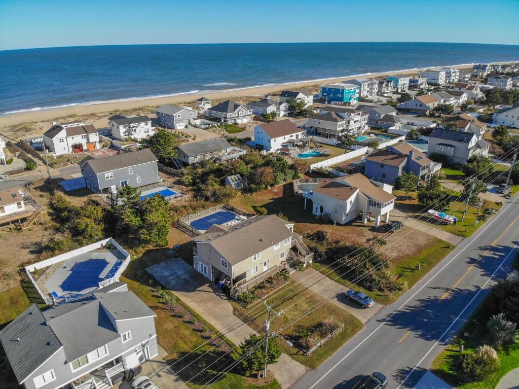 an aerial view of a neighborhood with houses and the beach at Star of the Sea in Virginia Beach