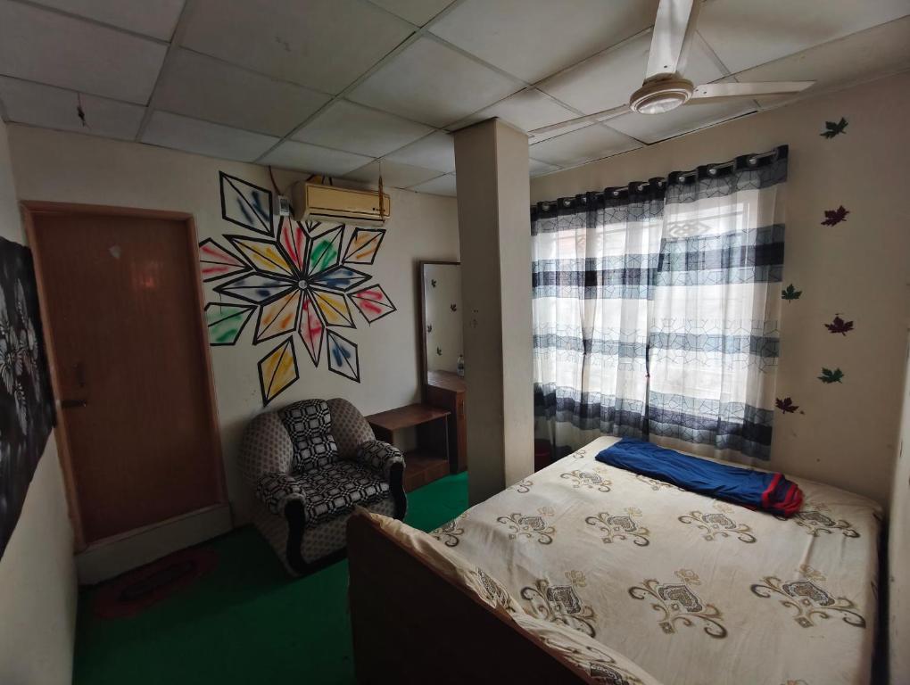 Postel nebo postele na pokoji v ubytování Hotel Priyashi International