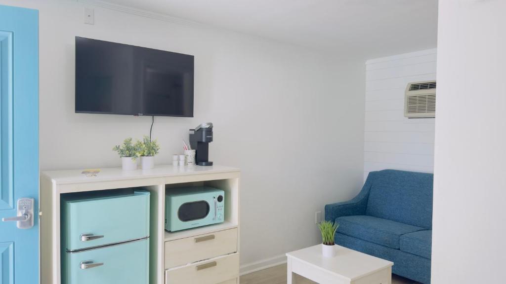 TV a/nebo společenská místnost v ubytování Boutique on the Beach