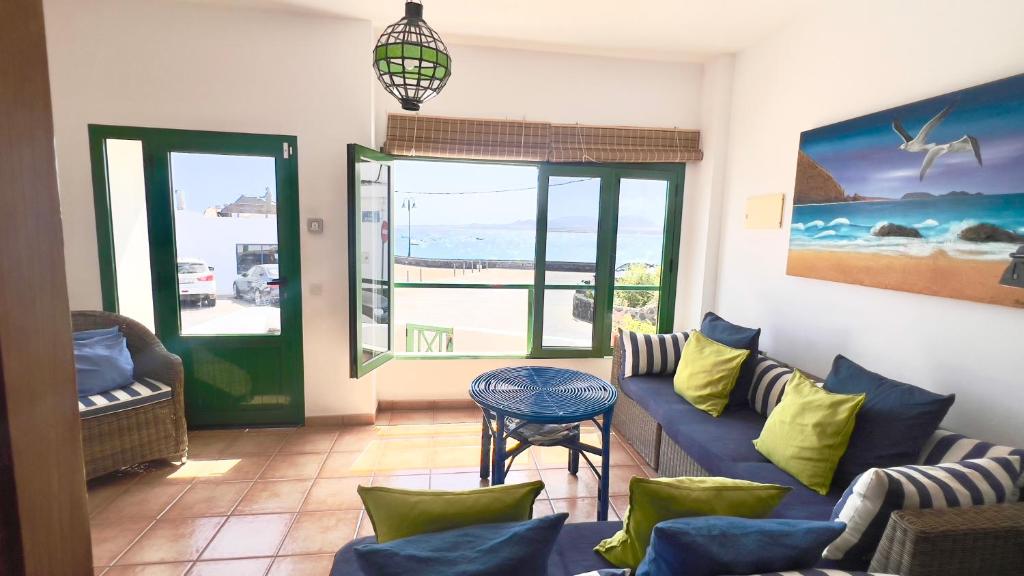 a living room with a couch and a table at Terraza del Mar in Arrieta