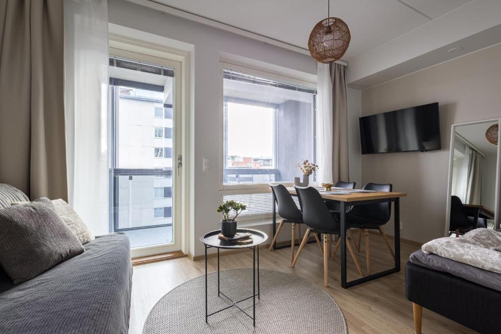 TV a/nebo společenská místnost v ubytování Pramea Apartments Asemankulma