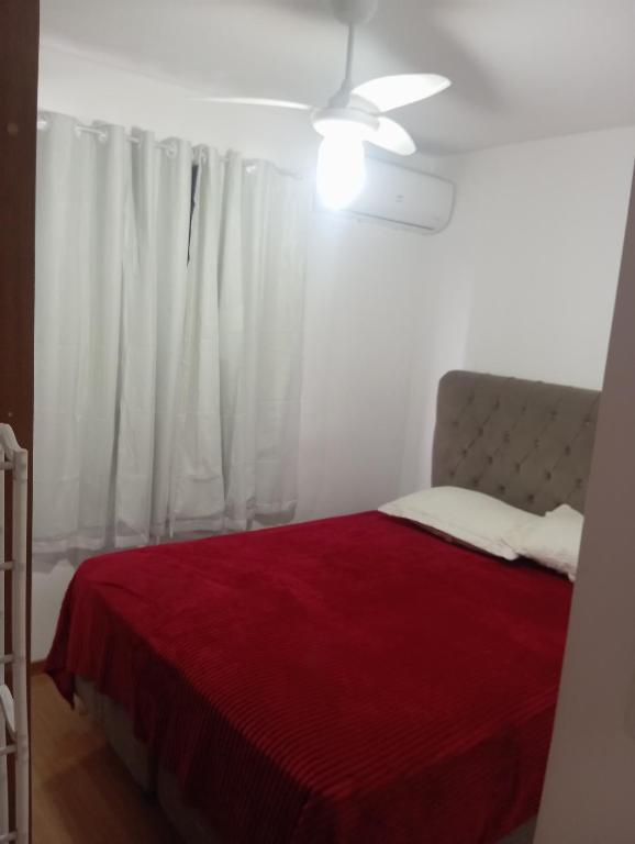 Ένα ή περισσότερα κρεβάτια σε δωμάτιο στο Cantinho do conforto