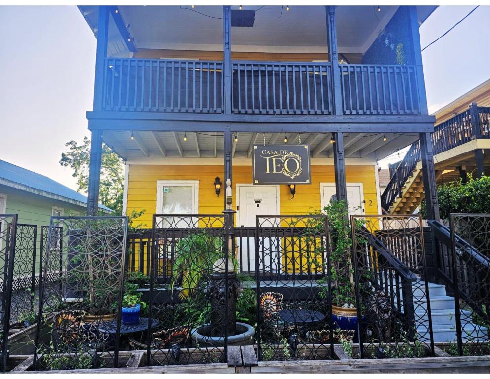 a yellow house with a sign in front of it at Casa de Teo Boutique Inn in Saint Augustine
