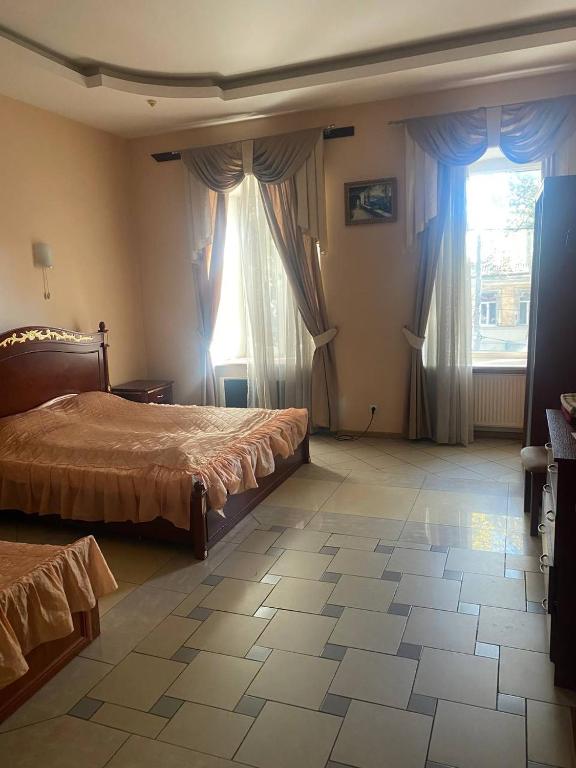 Postel nebo postele na pokoji v ubytování Апартотель Центр