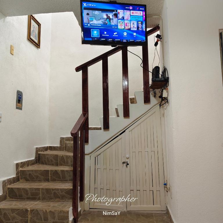 a flat screen tv on top of a stairway at Casa en Ixtapa in Ixtapa