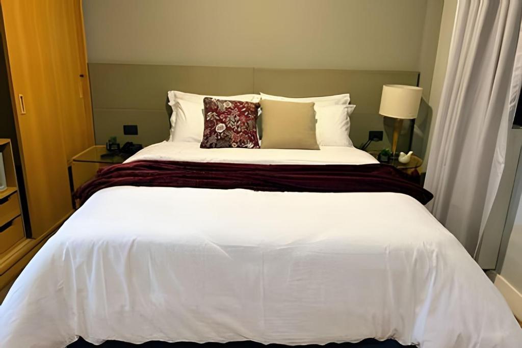 Кровать или кровати в номере TOP quarto Stay Inn hotel 3 min Av Paulista