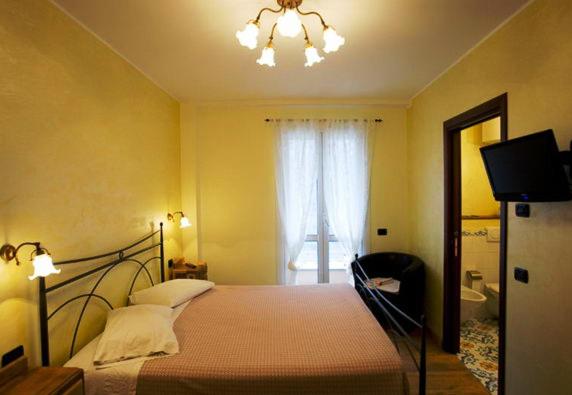 Postel nebo postele na pokoji v ubytování Albergo Cecchin