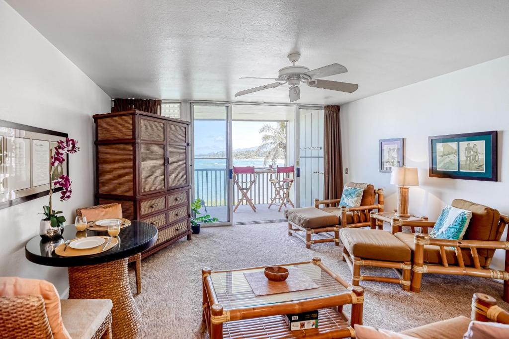 a living room with a couch and a table at Wailua Bay View 206 in Wailua