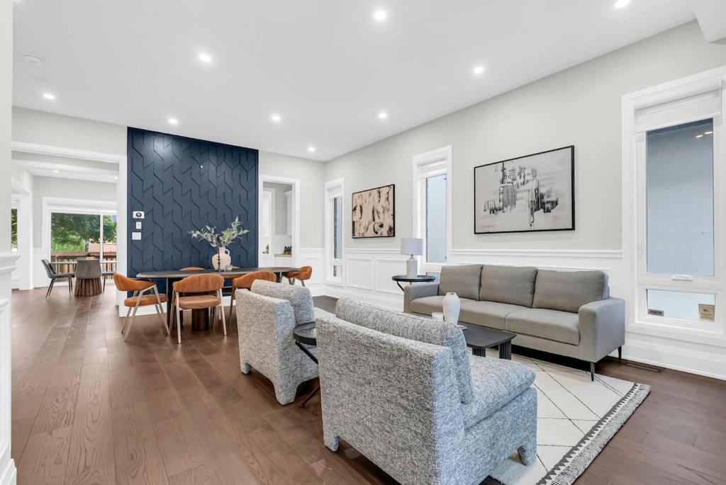 a living room with a couch and chairs and a table at Welcome to Your Comfort Retreat by the Lake in Burlington