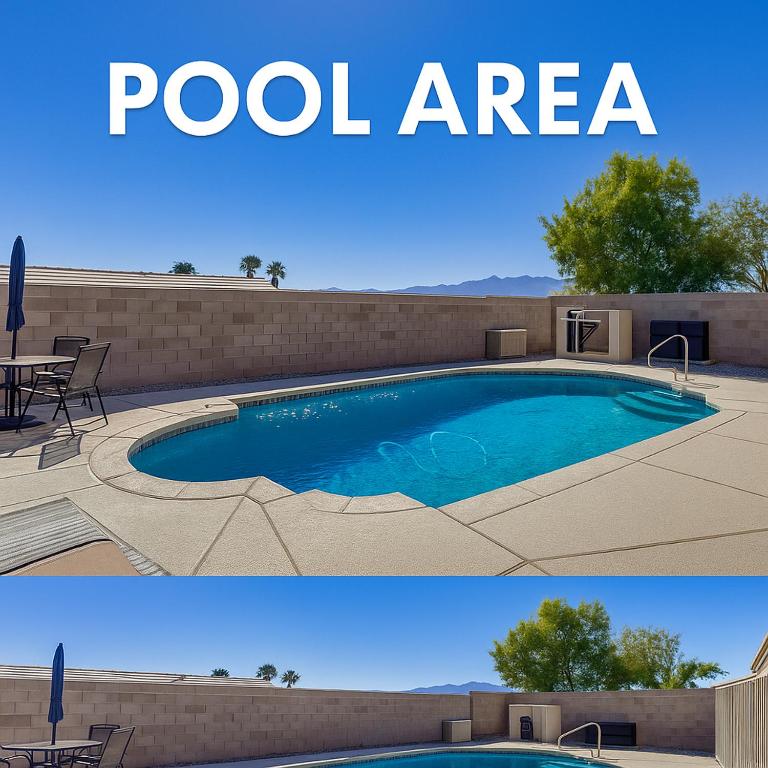 a pool area with a table and chairs next to it at Blue River Oasis in Bullhead City