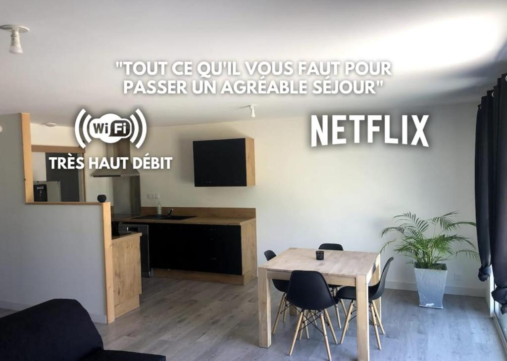a meeting room with a table and chairs at Hébergement au calme avec parking sécurisée in Derval