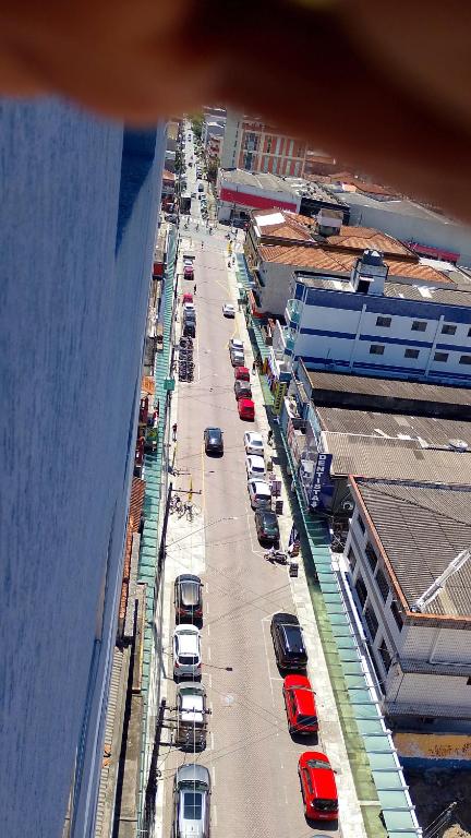 an overhead view of a city street with cars parked at Praia, Laser, Comércio in Praia Grande