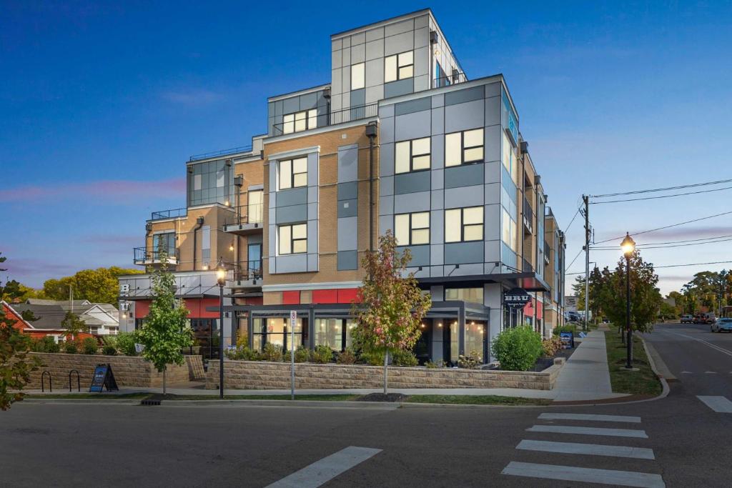 a tall building on the corner of a street at Stylish Downtown Escape Near IU and Cafes in Bloomington