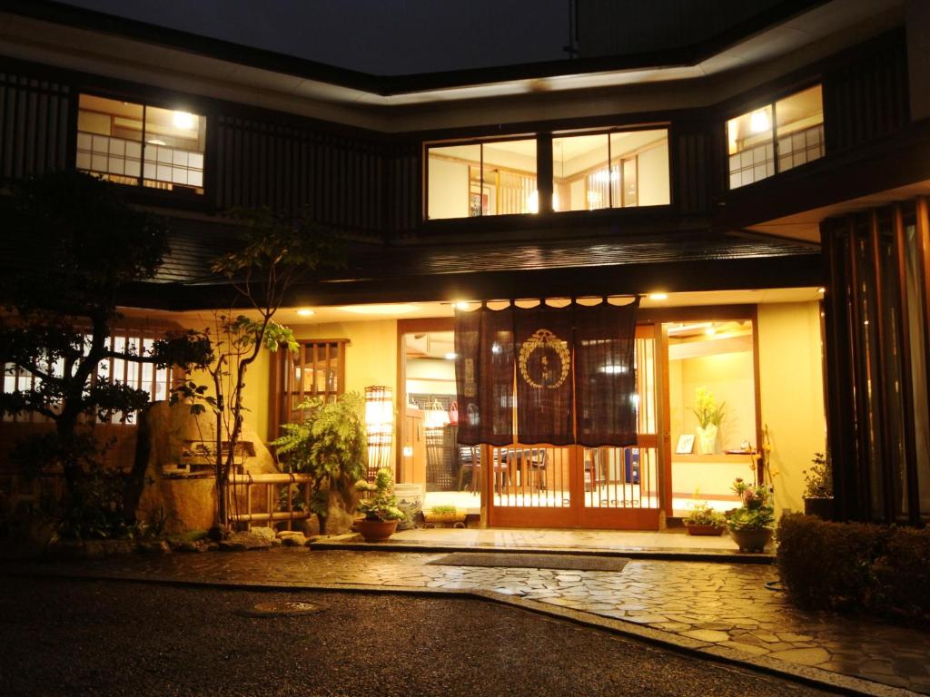 a house with a front door at night at Totaro in Ena