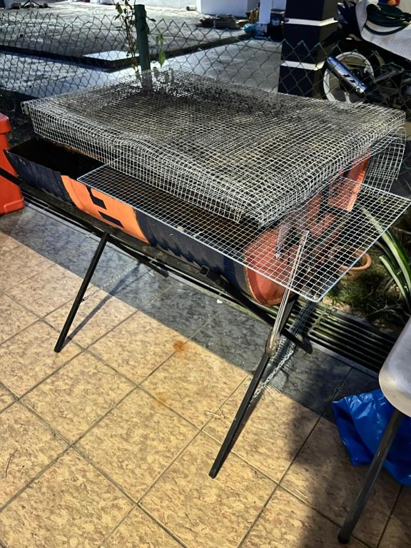 a bird cage sitting on top of a table at GL Homestay in Sibu