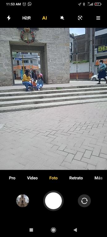 a picture of people sitting on the steps of a building at hospedaje QoriChaskas in San Antonio
