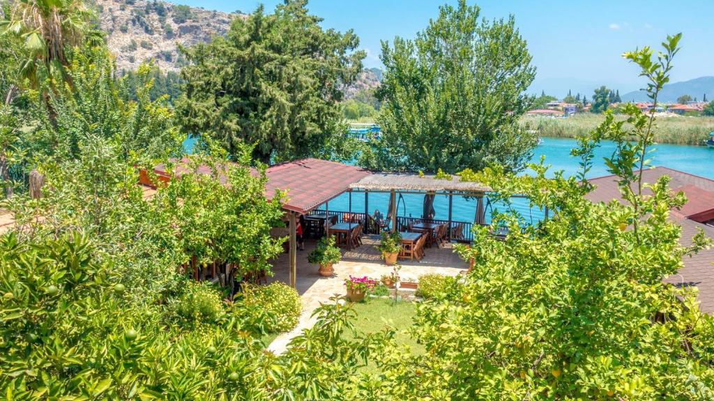 an aerial view of a house with a lake at Dalyan Pension in Dalyan