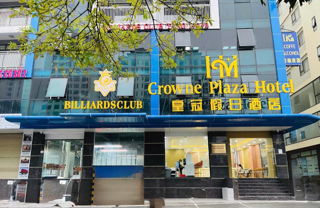 a building with a sign for a gourmet pizza hotel at Crowne Plaza Hotel in Bắc Ninh