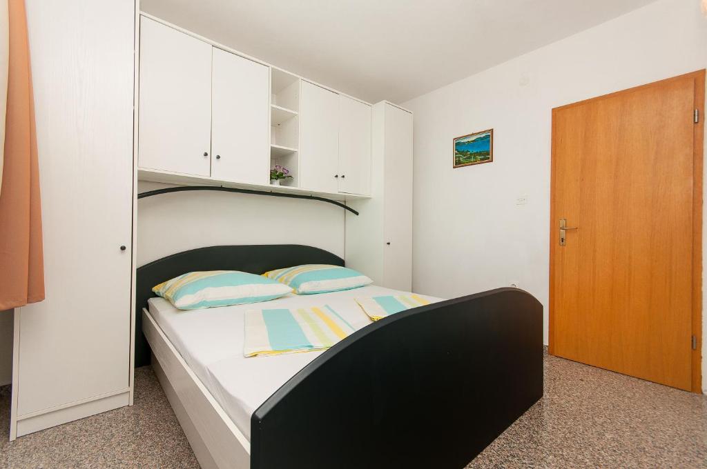 Postel nebo postele na pokoji v ubytování Apartmani Vesna