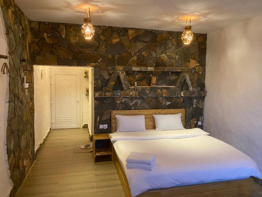 Postel nebo postele na pokoji v ubytování Panorama Guest House Jabal Shams