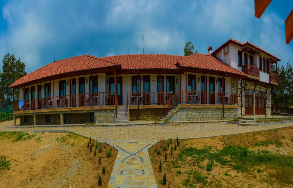 a large house with a red roof at Yagnevo Complex in Yagnevo