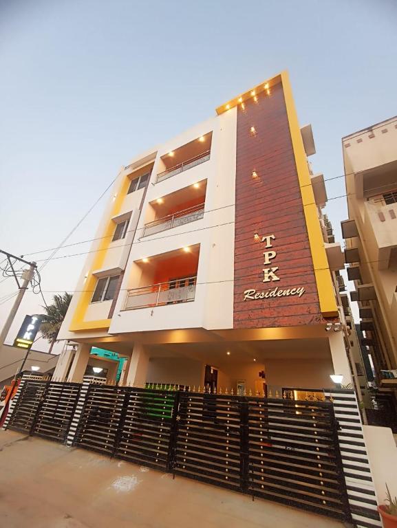 a tall building with stairs in front of it at TPK Residency in Thanjāvūr