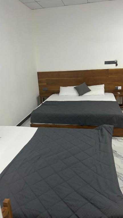 Postel nebo postele na pokoji v ubytování Green inn Trinco