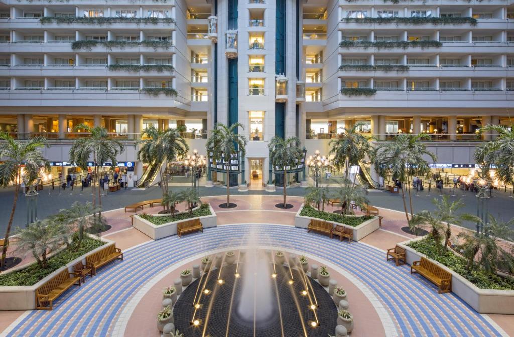 an overhead view of a building with a courtyard with palm trees at Hyatt Regency Orlando International Airport Hotel in Orlando