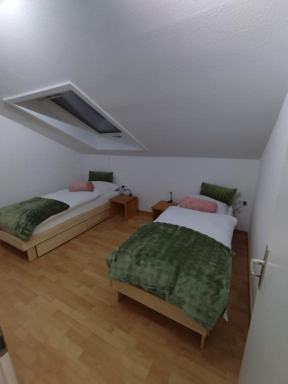 Postel nebo postele na pokoji v ubytování Lux-Apartment Böblingen