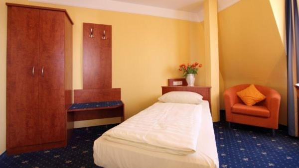 Postel nebo postele na pokoji v ubytování Aparthotel Astro - Nichtraucherhotel