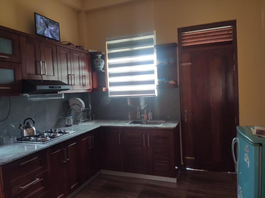 Kuchyň nebo kuchyňský kout v ubytování Nirmala Residence