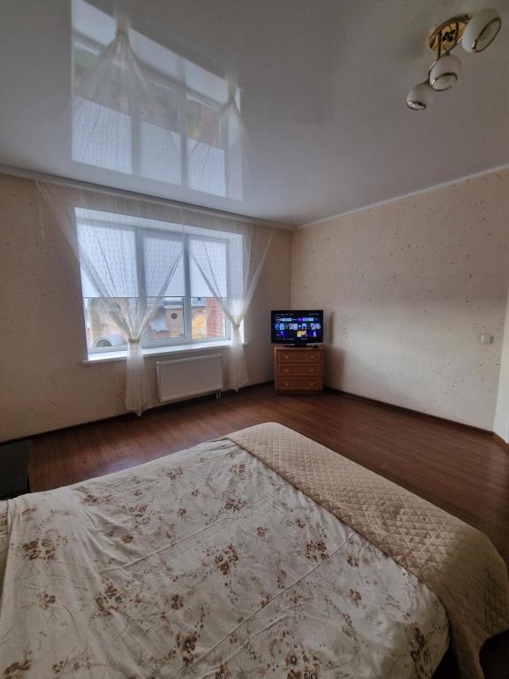 En eller flere senge i et værelse på Apartment on Chornovola, 44