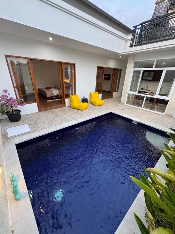 a swimming pool in the backyard of a house at Two D Villa in Ungasan