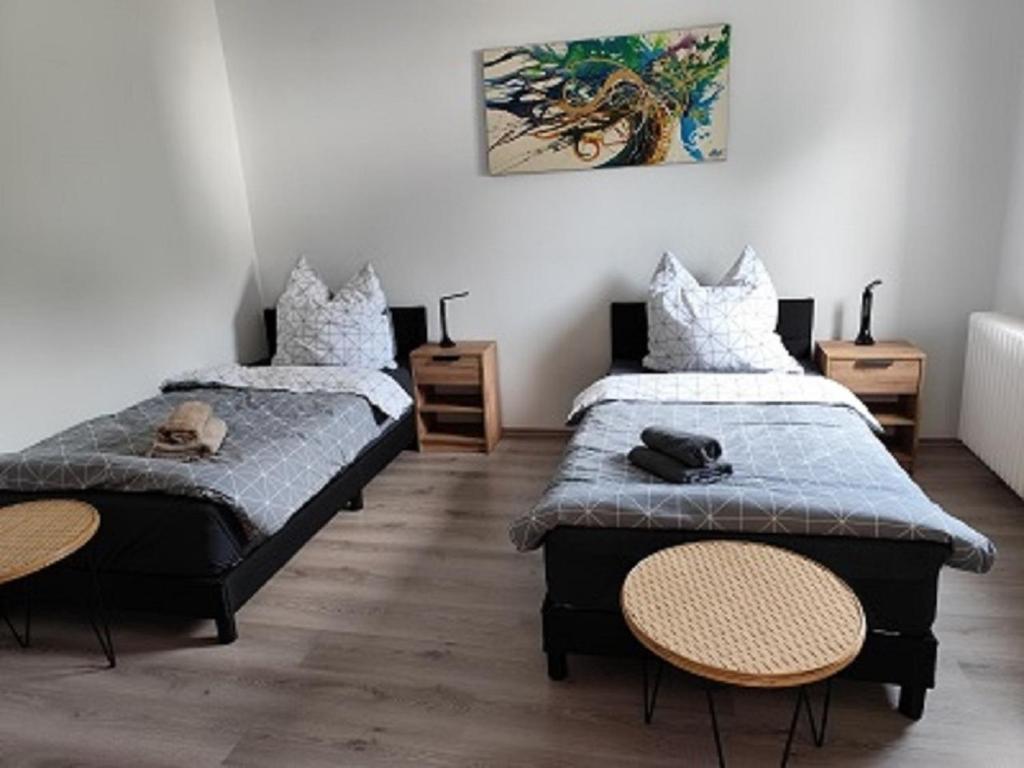 Ένα ή περισσότερα κρεβάτια σε δωμάτιο στο Charmantes Haus-im-Haus Apartment mit eigenem Hauseingang