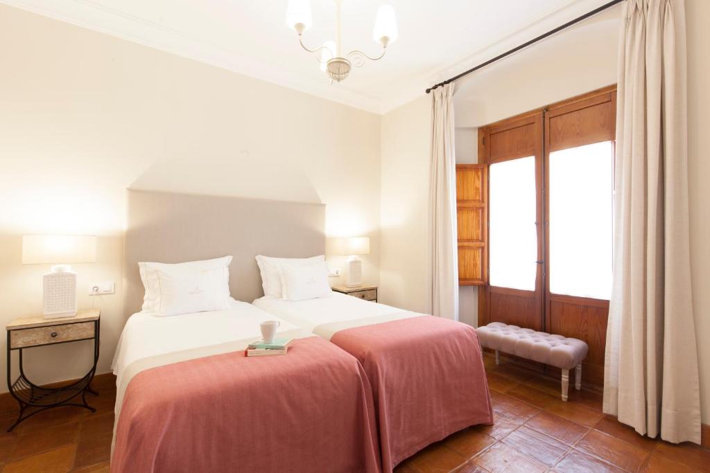Postel nebo postele na pokoji v ubytování Apartamentos Casa del Aceite
