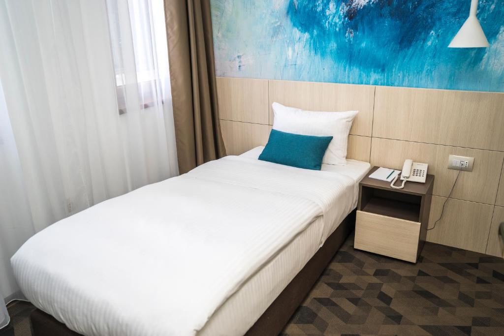 Postel nebo postele na pokoji v ubytování Hotel Kapetanovina