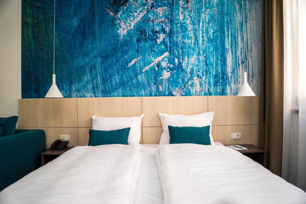 Postel nebo postele na pokoji v ubytování Hotel Kapetanovina