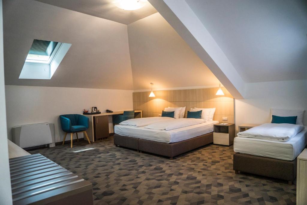 Postel nebo postele na pokoji v ubytování Hotel Kapetanovina