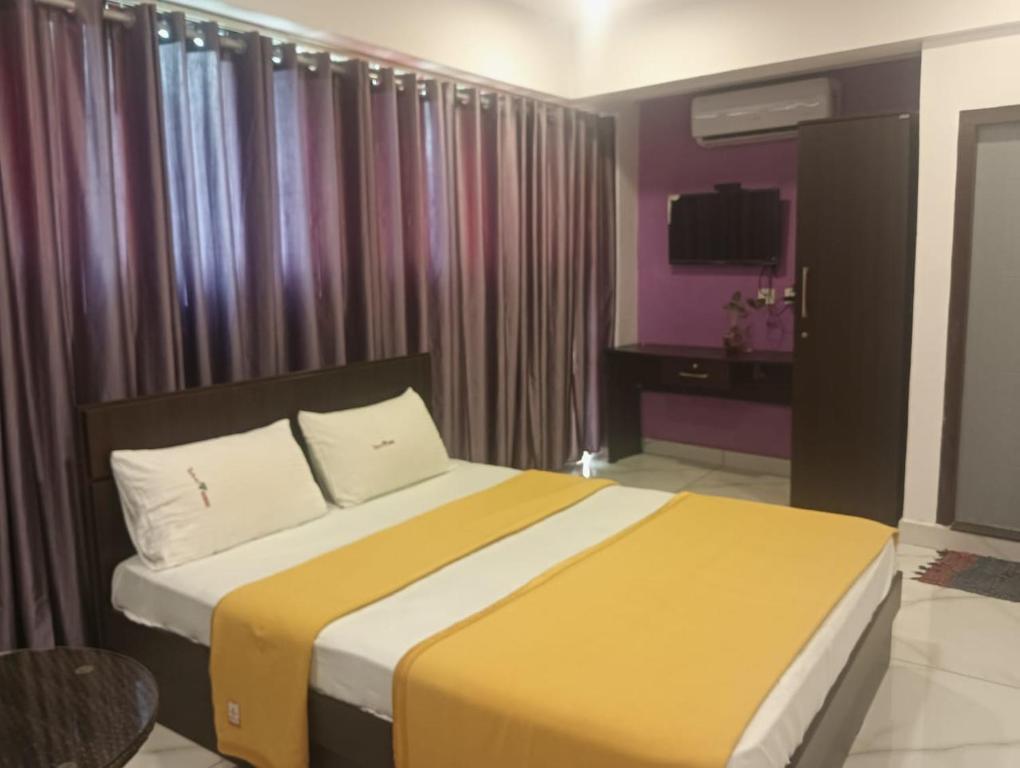 Ένα ή περισσότερα κρεβάτια σε δωμάτιο στο Tamar Residency