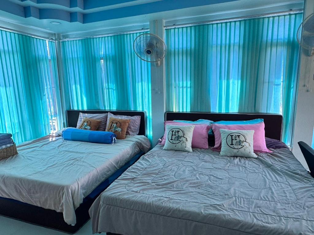 Ένα ή περισσότερα κρεβάτια σε δωμάτιο στο Sor Maharat Khaokho