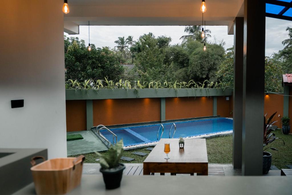 a view of a swimming pool from a house at Fathers Place Hiriketiya in Dickwella
