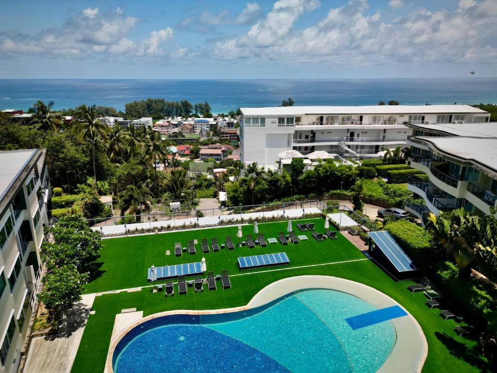 an aerial view of a resort with a swimming pool at Cozy Garden Apartment Butterfly Karon beach in Ban Karon