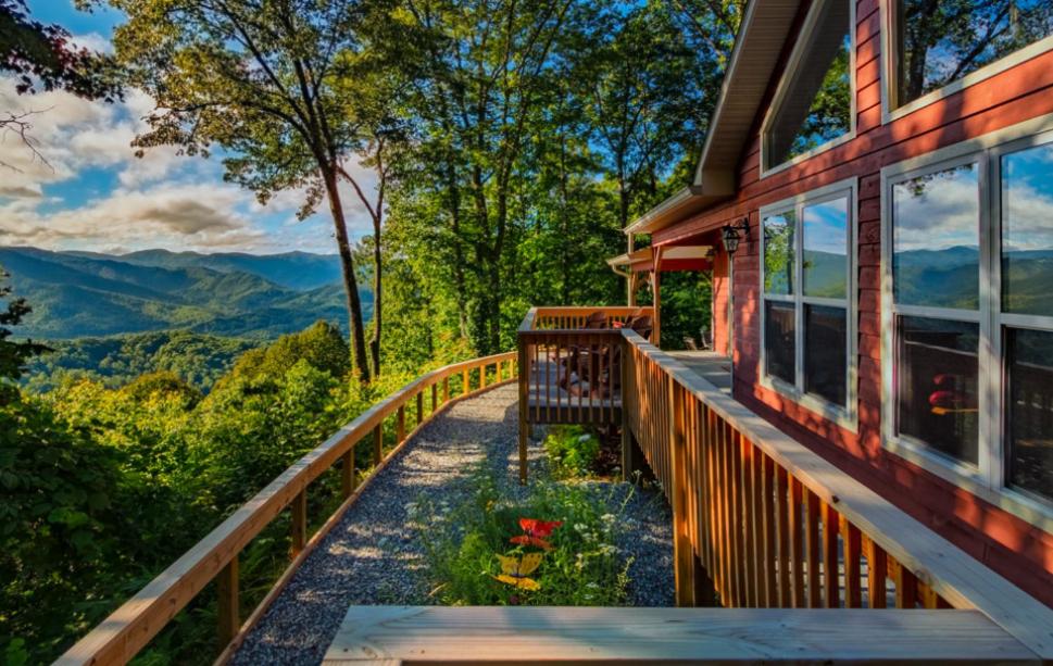 a porch of a house with a view of the mountains at Dream Weaver in De Hart Mill