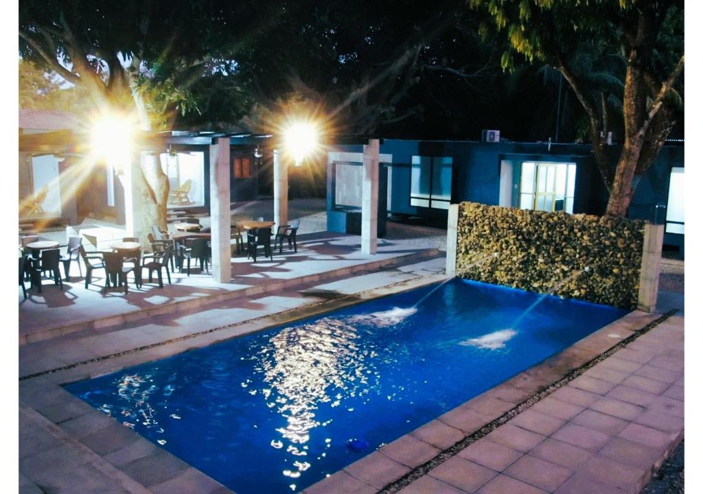 a swimming pool in the middle of a patio at night at Mango Beach in San Bernardo del Viento