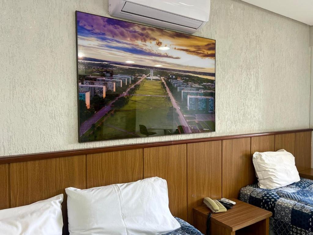 Voodi või voodid majutusasutuse Garvey 210 Studio Esplanada By Hospede Fácil toas