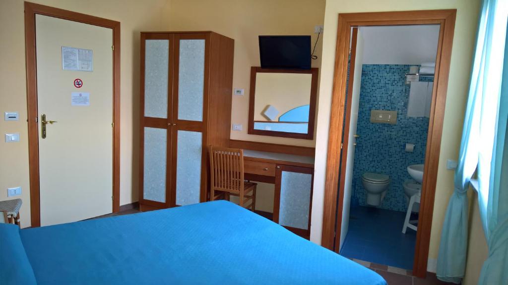 Postel nebo postele na pokoji v ubytování Il Gabbiano