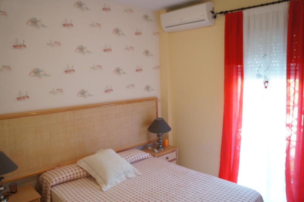 Posteľ alebo postele v izbe v ubytovaní Apartamento Islantilla