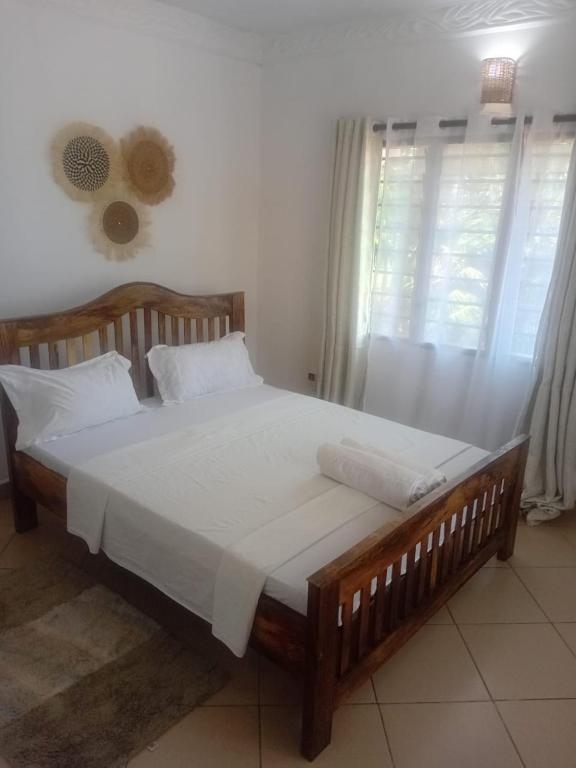 Ένα ή περισσότερα κρεβάτια σε δωμάτιο στο Ndoto House