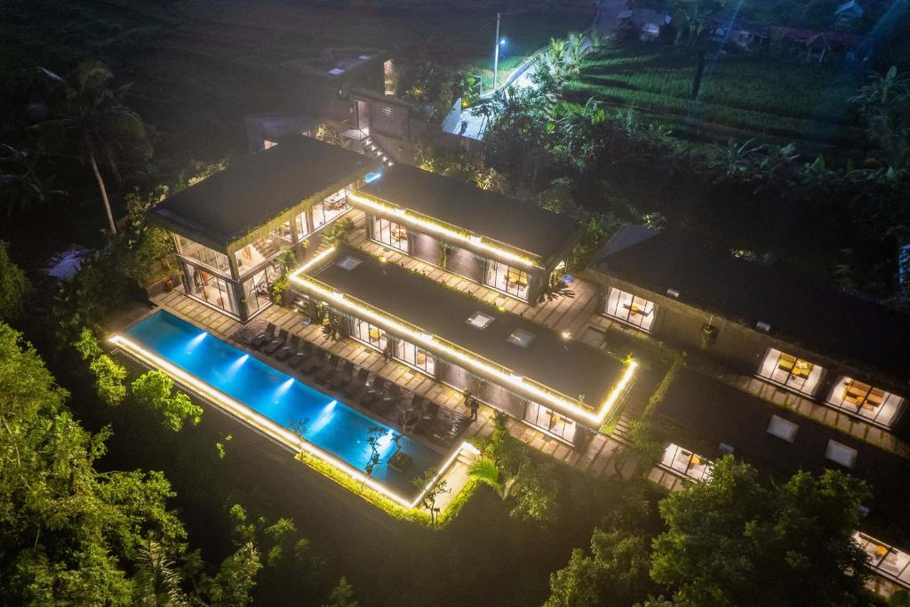 an aerial view of a mansion at night at The Garden Villas in Ubud